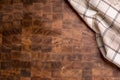 Top of view checkered tablecloth on empty wooden butcher board