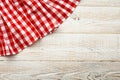 Top view of checkered tablecloth on white wooden table. Royalty Free Stock Photo
