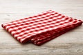 Top view of checkered tablecloth on white wooden table. Royalty Free Stock Photo