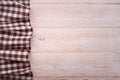 Top view of checkered tablecloth on white wooden table. Royalty Free Stock Photo