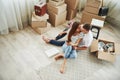 Top view. Cheerful young couple in their new apartment. Conception of moving