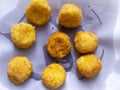 Top view of cheese balls on white paper