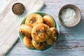 Top view on Cheese Bannock in plate on rustic wood table copy space