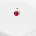 Top view of a cherry berry on a white background. Ripe cherrie texture.