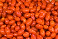 Cherry tomatoes on the counter of the vegetable market. Close-up and top view of fresh vegetables on store shelves. Royalty Free Stock Photo