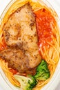 chicken cutlet with tomato and meat sauce pasta at vertical composition Royalty Free Stock Photo