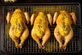 top view of chicken legs with melted garlic butter on cooling rack