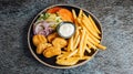 Top view of chicken nuggets, fries, veggies, and mayo Royalty Free Stock Photo