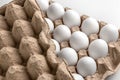 Top view on chicken raw eggs in opened carton recyclable cardboard box. Close-up view on natural pattern with copy space, easter Royalty Free Stock Photo