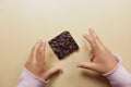 top view of child hand reaching for dark chocolate Royalty Free Stock Photo
