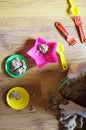 Child`s hands playing with kinetic sand and colorful plastic toys Royalty Free Stock Photo