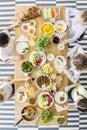 Top view of children eating healthy homemade meal. Wooden table