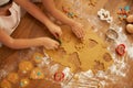 Top view, children hands and baking with cookie cutters in house or family home kitchen with pastry, eggs or sweets Royalty Free Stock Photo