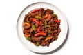 Top View Chinese Beef And Peppers In Black Bean Sauce On Round Plate On Wihte Backgound