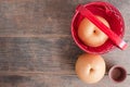 Top view of Chinese peas, Yellow Asian Apple Pears in a basket w