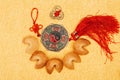 Chinese talisman surrounded with fortune cookies on golden surface, Chinese New Year concept