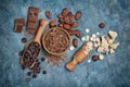Top view of chocolate chips, bars and drops with cocoa beans for confectionery Royalty Free Stock Photo