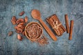 Top view of chocolate chips and cocoa powder with cinnamon sticks and cocoa beans Royalty Free Stock Photo