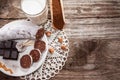 Top view on chocolate salami on plate and wooden scoop with coco