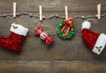 Top view Christmas decoration and jewelry clothesline on wood Royalty Free Stock Photo