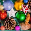 Top view of Christmas decoration, tinsel, pinecones, stars and