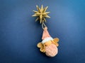 Top view Christmas decorations. Christmas angel and golden star on blue background. Royalty Free Stock Photo