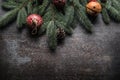 Top of view christmas decorations jingle bells fir tree pine cones on free concrete background Royalty Free Stock Photo
