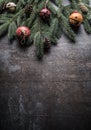 Top of view christmas decorations jingle bells fir tree pine cones on free concrete background