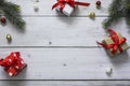 Top view of christmas gift boxes, balls and fir branches on white wooden desk with space for your text Royalty Free Stock Photo