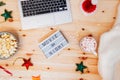 Top view Christmas Movie night concept. Flat lay composition with Movie night message on the board, laptop, popcorn bowl Royalty Free Stock Photo