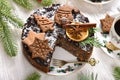 Top view of Christmas pastry called Japanese poppy seed cake decorated with gingerbread cookies