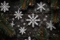 Top view Christmas snowflakes, fir tree branches on wooden black background. Royalty Free Stock Photo