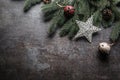 Top of view christmas star decorations jingle bells fir tree pine cones on free concrete background Royalty Free Stock Photo