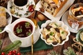 Top view on Christmas table with red borscht with dumplings and other dishes Royalty Free Stock Photo