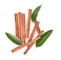 Top view of cinnamon stick spice and green leaf isolated on white background Royalty Free Stock Photo