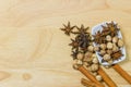 Top view of Cinnamon sticks, best cardamom and star anise spice on wooden board. fragrant fruits Royalty Free Stock Photo