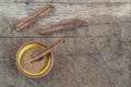 Top view cinnamon sticks and powder in bowl on wooden table Royalty Free Stock Photo