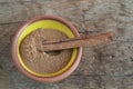 Top view cinnamon sticks and powder in bowl on wooden table Royalty Free Stock Photo