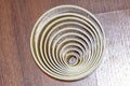 Top view of a circle is a simple shape in Euclidean geometry.a closed curve on a wooden surface