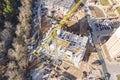 Top view of city construction site with high yellow tower crane. drone photography Royalty Free Stock Photo