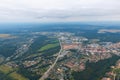 Top view of the city, road, fields and forest