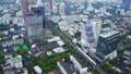 Top view city and Sky Train of Bangkok going out from station. Top view of modern city and traine going