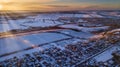 Top view of city suburbs or small town nice houses on winter sunset on cloudy sky background