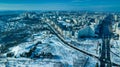 Top view of city in winter at sunset on sky background.