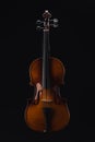 Top view of classical wooden cello isolated on black.