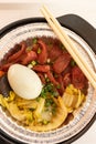 Clay pot rice of Chinese style sausage and salty duck egg and vegetable vertical composition