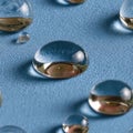 Top view of clear water droplets on a blue background featuring an abstract texture and ample copy space for design uses SEAMLESS Royalty Free Stock Photo