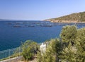 Top view from the cliffs of the Aegean sea and a fish farm on the Greek island of Evia in Greece on a Sunny day