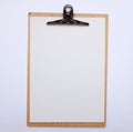 Top view Clipboard With Blank Paper on white office table