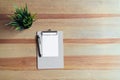 Top view clipboard with pen and white paper on the table background. Royalty Free Stock Photo